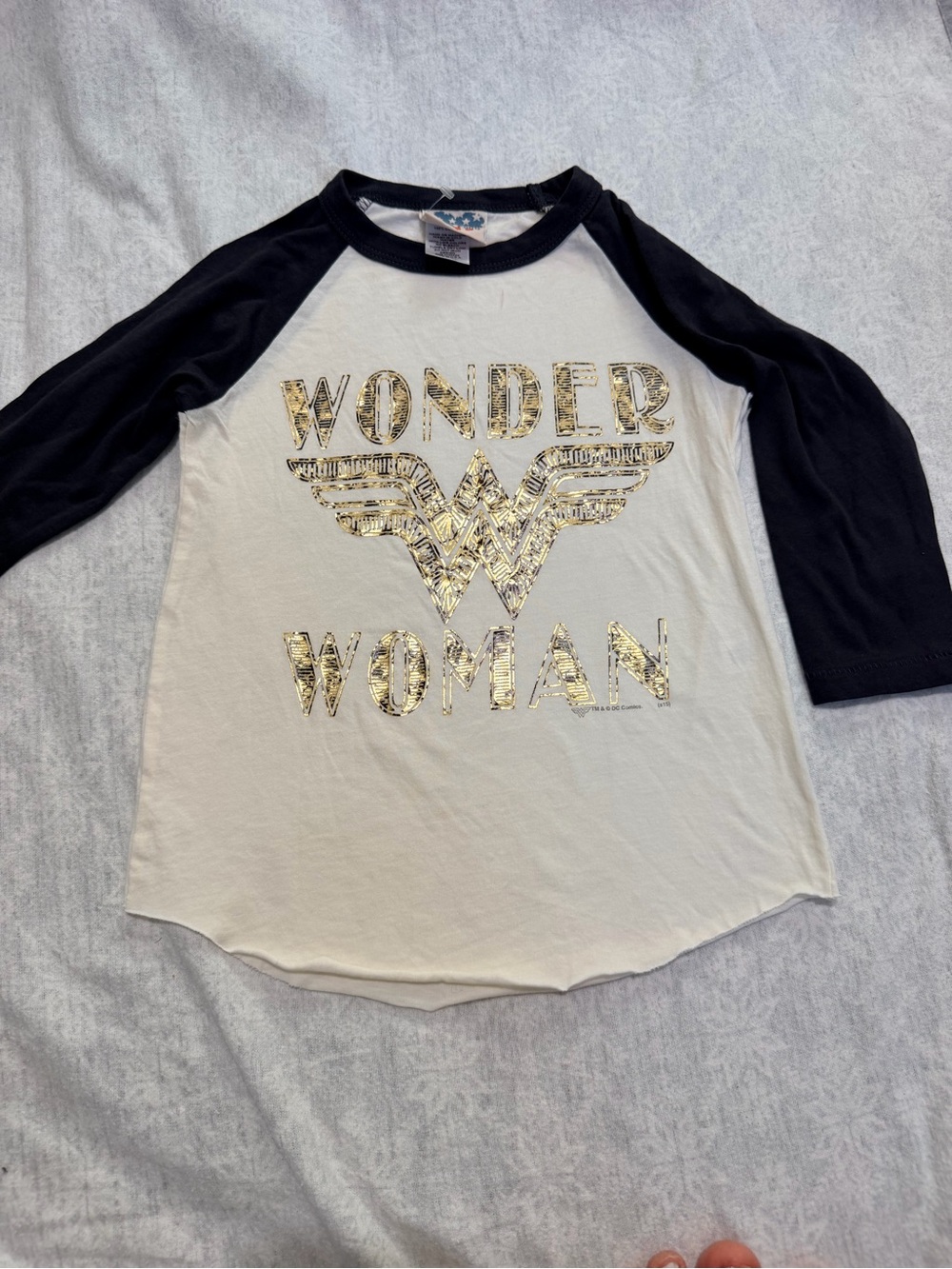 Junk Food Clothing Girls' White/ Black Raglan Tee with Gold Wonder Woman Logo XS